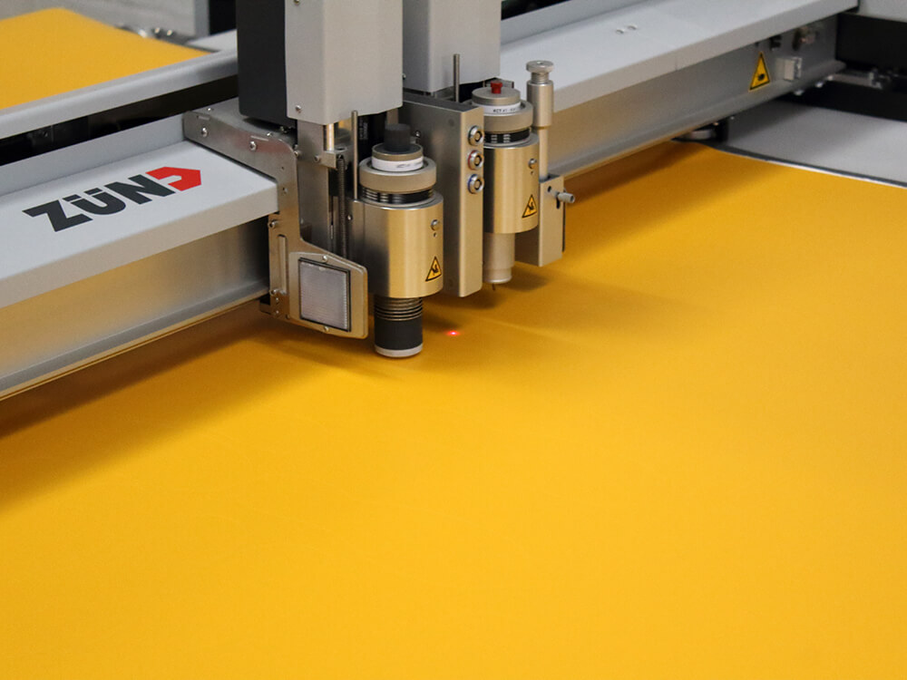 Zund Digital Die Cutting Machine Cutting Yellow Non Slip Material into Shoe Shapes 1